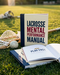 Lacrosse Mental Performance Manual book on a grass field