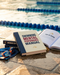 Swimming Mental Performance Manual book on a pool deck