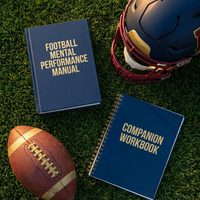 Football manual and workbook flat lay on turf