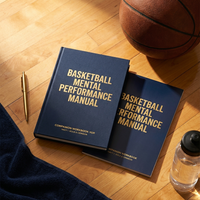Basketball manual and workbook flat lay on a court