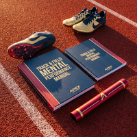 Track & Field manual and workbook flat lay on a running track